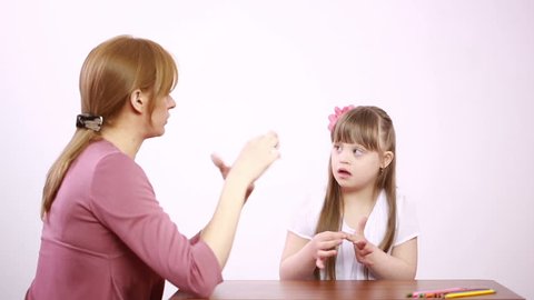 Downs Syndrome girl having speech therapy