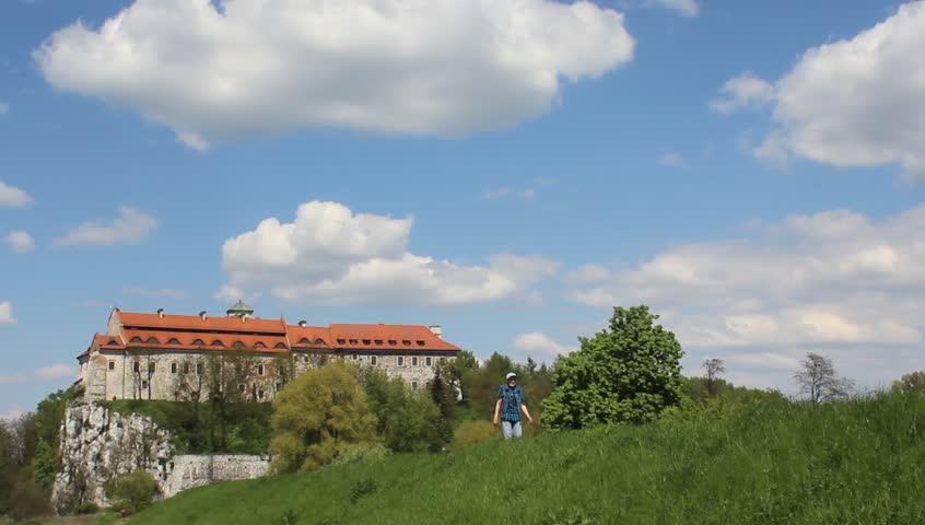 Male disabled person on a walk near the old monastery.
