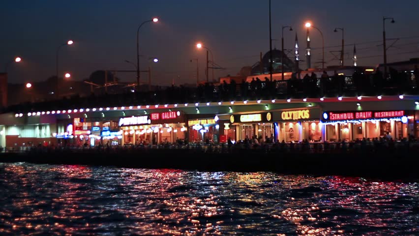 ISTANBUL - NOVEMBER 13: Crowd of people enjoy themselves on Galata Bridge on