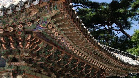 GUEONGJU, KOREA - AUGUST 13, 2013: Exterior of the colorful decorated roof of the Kwan Um pavilion in Bulguksa temple in Gueongju, Korea. Bulguksa temple is a UNESCO World Heritage site.