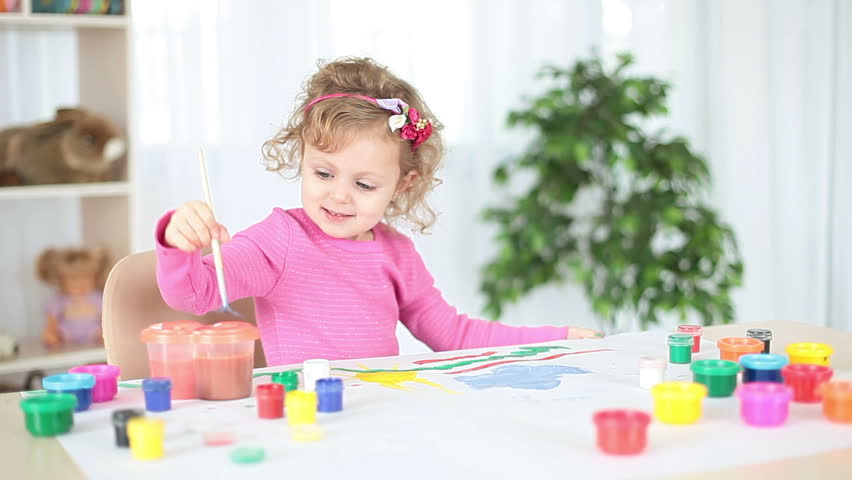 Child painting colors 