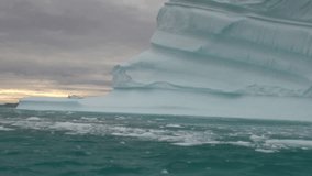 Big Iicebergs floating in sea around  Greenland in icefjords. Fantastic wonderful amazing video grenland nature iceland. Lovely shooting the life of nature, seaside and mountains. Global warming.