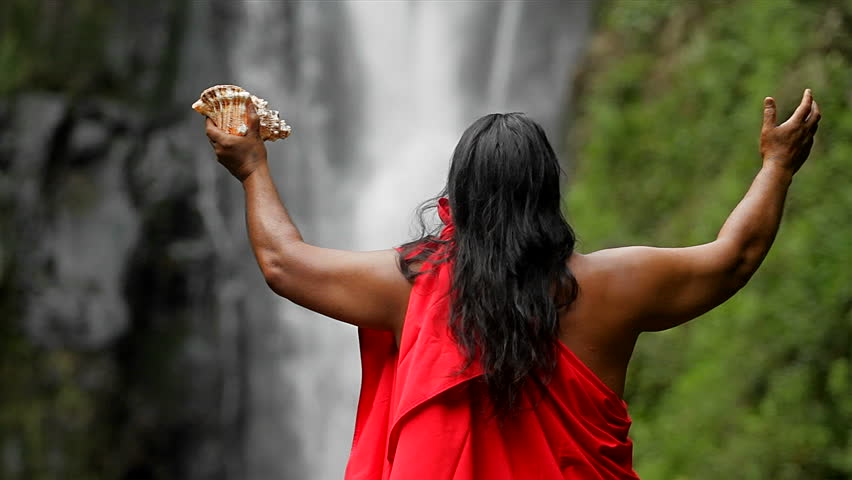 shaman against a waterfall