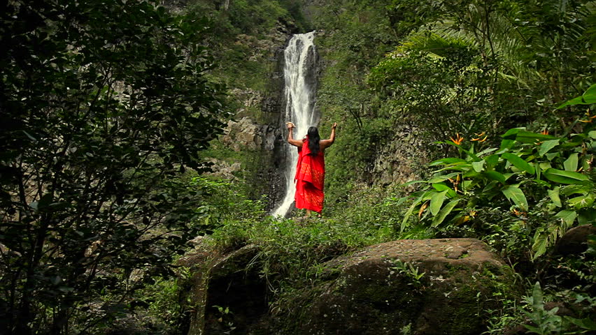 shaman against a waterfall