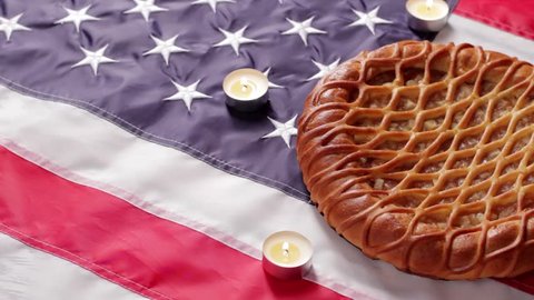 American flag, pie and candles. Bakery and candles with flag. Welcome home, patriot. Freedom, peace and warmth.