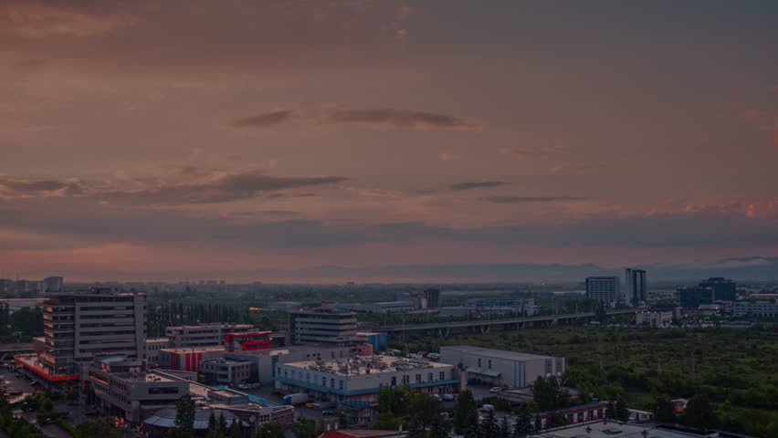Time lapse footage. Business park at nightfall. View of office buildings in the suburbs. Europe - Balkan peninsula, Sofia city, Bulgaria.