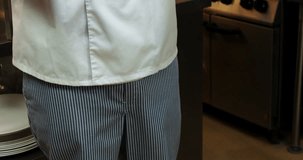 Chef holding a plate with food