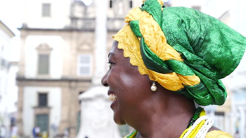 Brazilian woman of African descent, smiling, dressed in traditional Baiana attire in Pelourinho, Salvador, Bahia, Brazil Royalty-Free Stock Footage #16478161