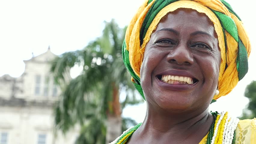Brazilian woman of African descent, smiling, dressed in traditional Baiana attire in Pelourinho, Salvador, Bahia, Brazil Royalty-Free Stock Footage #16478206