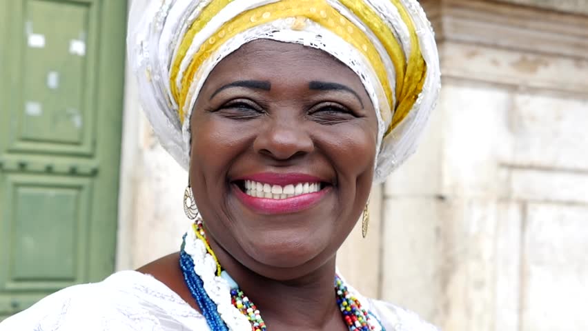 Brazilian woman of African descent wearing traditional clothes from the state of Bahia in the old colonial district of Salvador (Pelourinho), Brazil Royalty-Free Stock Footage #16478227