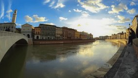 Sunset on the river arno in the city of Pisa, tuscany , italy