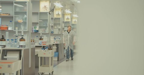 Scientists walking in a pharmaceutical lab