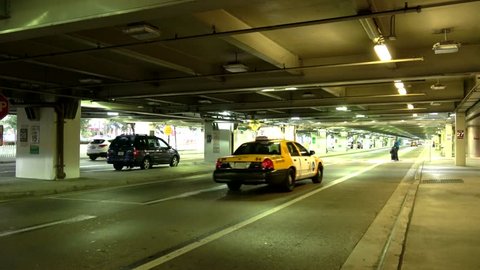 Passanger drop off zone with taxi cabs at Miami Airport - MIAMI, FLORIDA APRIL 10, 2016