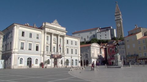PIRAN/CROATIA 29TH SEPTEMBER 2010: Sunny view of Tartini Square in Piran, with St Georges Church in the background. Slovenia