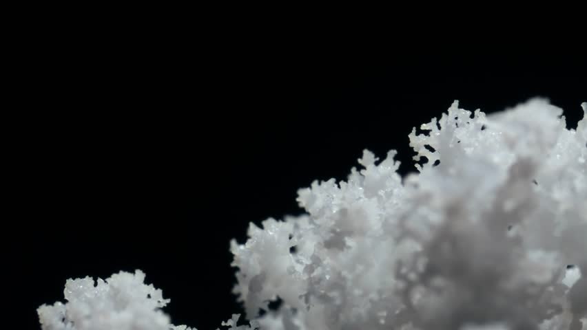 macro shot of growing crystals, close up of forming ice crystals, growing cells