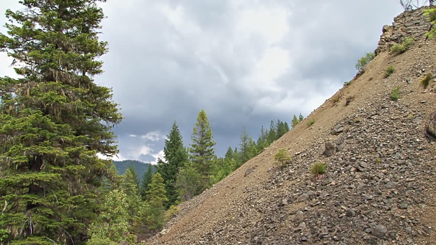 Static shot of a blasted hillside of a hydraulic gold mine in Northern