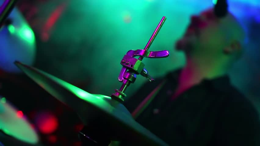 A drummer plays on stage.