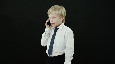 schoolboy is talking on a phone