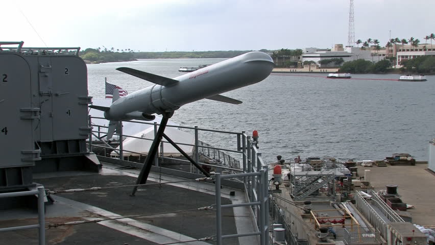 USS Missouri docked at Ford Island in Pearl Harbor, Honolulu, Oahu, Hawaii. Cruise missile on display from deck of battleship