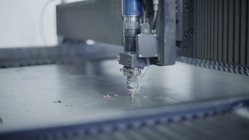 Cut sheet metal at workshop. Modern tool in heavy industry. Dangerous job. High precision manufacture of steel parts. Automation of process indoors. Automatic work for ironwork. Close up computer cnc Royalty-Free Stock Footage #16575883