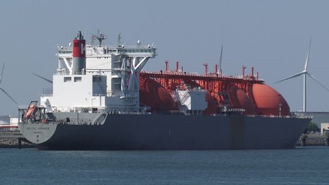 SEAPORT ROTTERDAM - MAY 2016: LNG tanker Arctic Voyager with Moss Spherical cargo tanks for high pressure liquid gas at GATE (Gas access to Europe) terminal, nijlhaven - side view