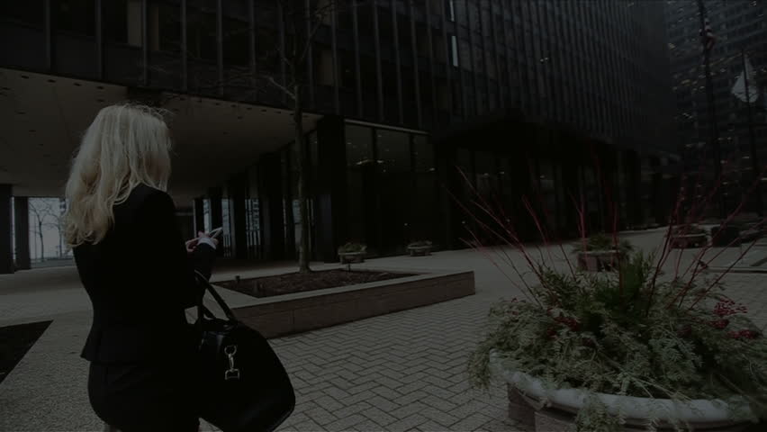 a Beautiful Girl With a Black Bag in Hand,a Beautiful Girl With a Phone in Chicago,a Beautiful Blonde Girl,beautiful Architecture Chicago,lady in White Shirt,slow Shooting,tall Buildings in Chicago,