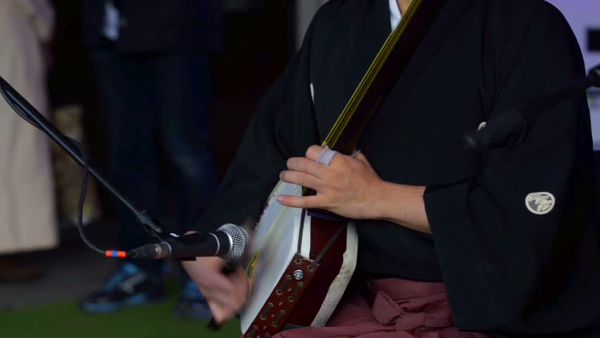 Japanese artist are playing on traditional musical shamisen instrument | Shutterstock HD Video #16579930