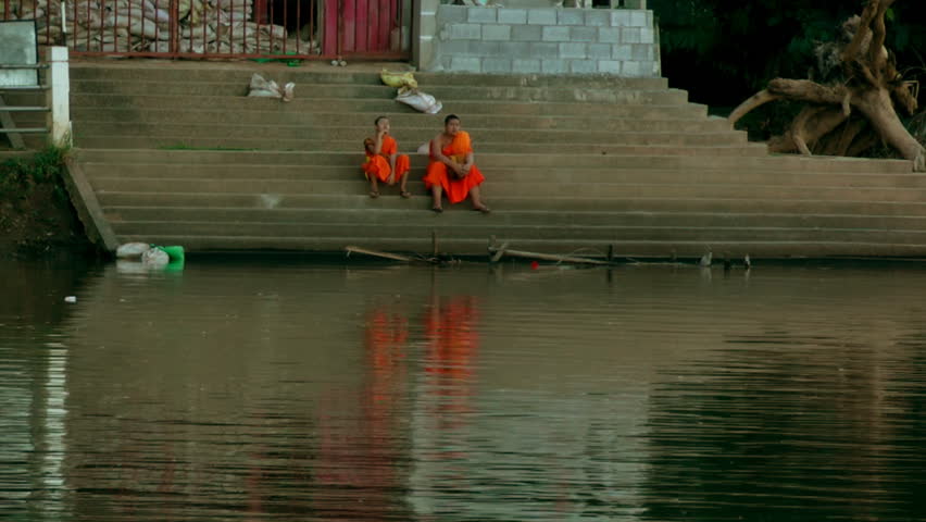 CHIANG MAI, THAILAND - CIRCA OCTOBER 2011 - Compilation  Monks survey the damage