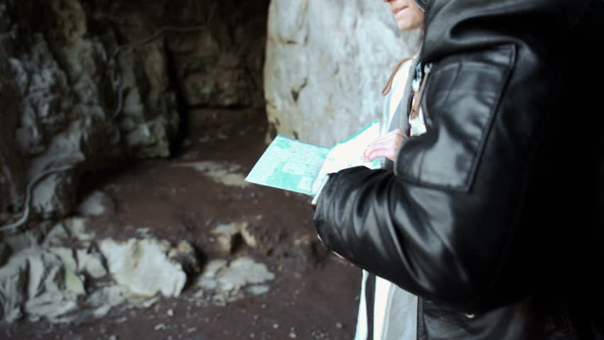 Couple hiking. Using map to get good direction,