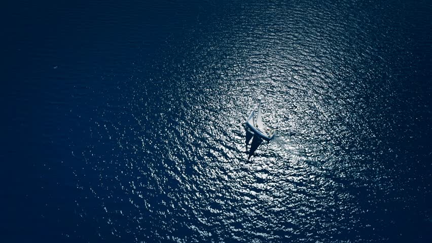 Yacht sailing on opened sea. Sailing boat. Yacht from drone. Yachting video. Yacht from above. Sailboat from drone. Sailing video. Yachting at windy day. Yacht. Sailboat. Royalty-Free Stock Footage #16596538
