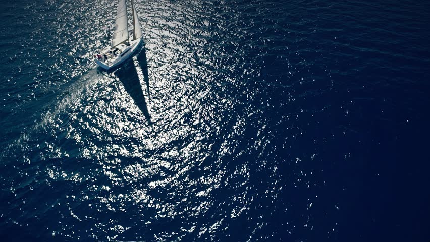Yacht sailing on opened sea. Sailing boat. Yacht from drone. Yachting video. Yacht from above. Sailboat from drone. Sailing video. Yachting at windy day. Yacht. Sailboat. Royalty-Free Stock Footage #16596541