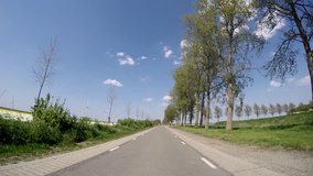Video footage P.O.V. Of driving in the netherlands in agricultural landscape