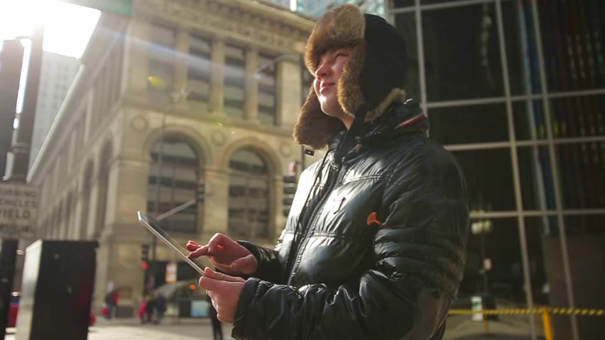 Man With Tablet Crossing the Road in Chicago