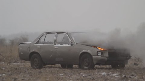 Car explosion on an empty field