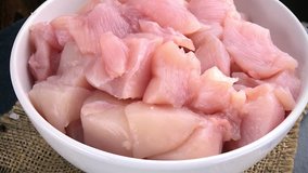 Portion of rotating chopped Chicken Fillet (not loopable; 4K clip)