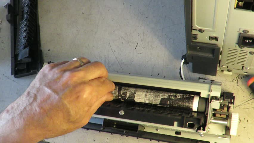 Technician repairs the printer fuser | Shutterstock HD Video #16649842