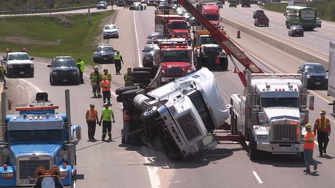 Guelph, Ontario, Canada May 2016 Tractor trailer truck crash on highway with police and firefighters at scene