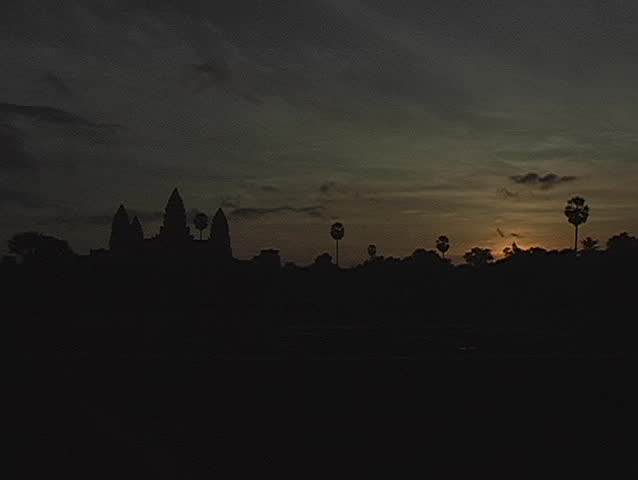 Sunrise time lapse over Angkor Wat temple ruins in Cambodia