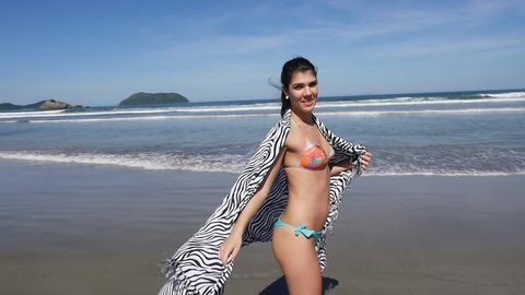 Brazilian Woman with sarong at the summer beach in Brazil in Slow Motion