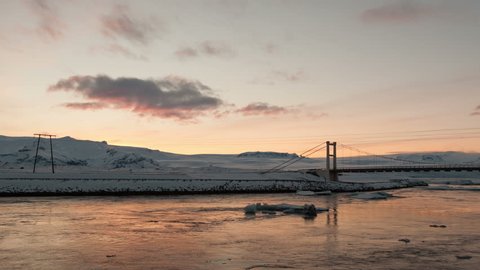 4K Time lapse zoom out of icebergs moving in the Glacier Lagoon Jokulsarlon in Iceland at sunset