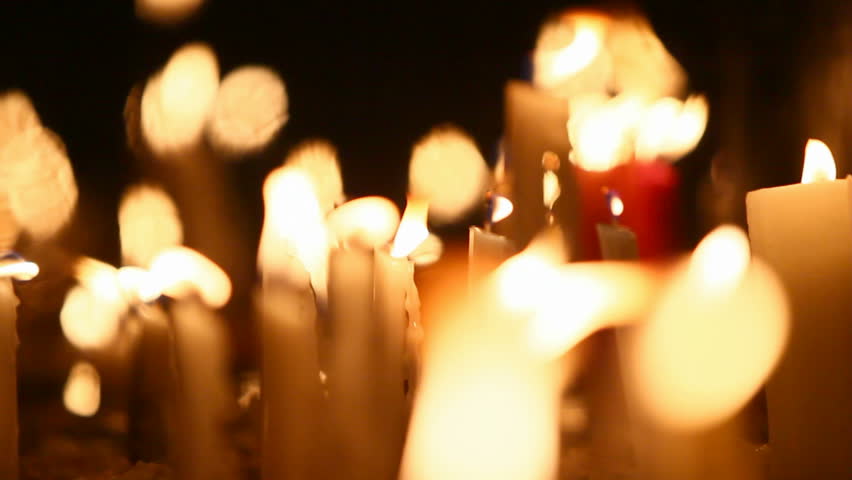 Religious candles burning shallow depth of field.