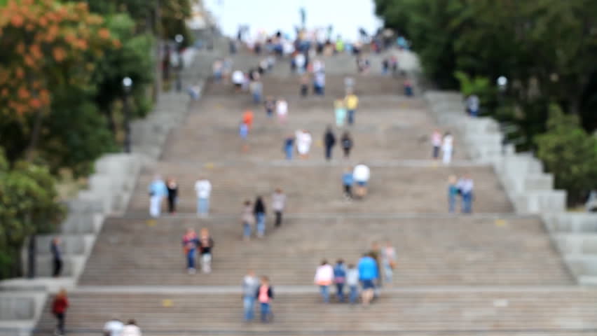 People walk on the Potemkin Stairs in Odessa  /  People walk on the Potemkin Stairs in Odessa, blurred abstract background
