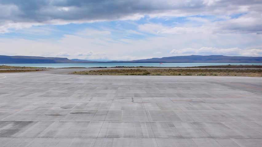 Commercial Airplane Landing at El Calafate Airport with View of Lago Argentino and Patagonian Mountains, Santa Cruz, Argentina