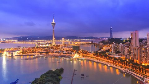Macau Cityscape Day To Night Time Lapse (pan shot)
