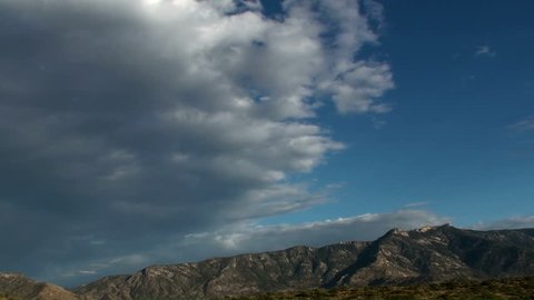 Time Lapse, Clouds dissipate over mountains at dusk. 1920x1080