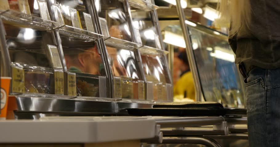 people in the canteen  choose what to eat