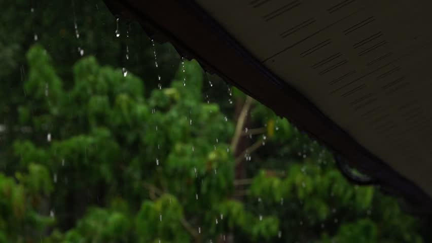 The roof of the forest house under a strong rain shower in the mountains. Slow motion - Powered by Shutterstock - Get 15% off with code: PIKWIZARD15