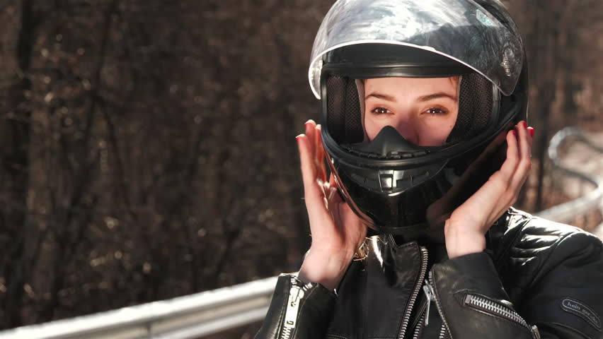 woman in motorcycle helmet