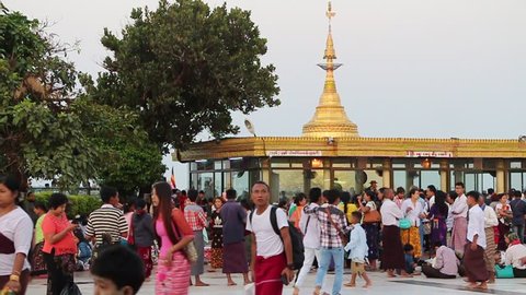 Myanmar  - April 12 2016 : Power of  faith to Kyaikhtiyo, Myanmar people and tourist walking on ground near by Kyaikhtiyo,Myanmar 