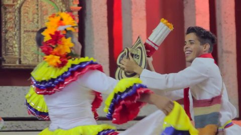 CARTAGENA, COLOMBIA, CIRCA 2015: couple dancing cumbia, traditional Colombia music 